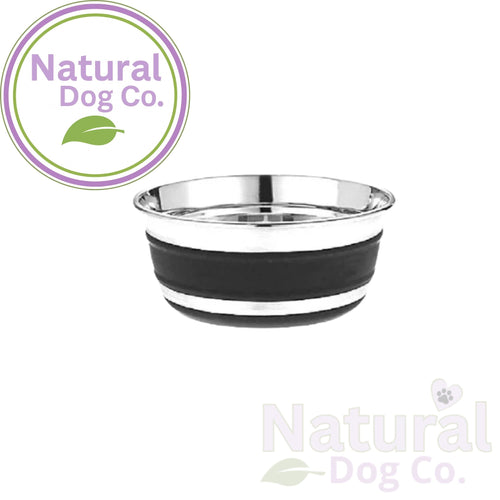 Stainless steel dog bowl with black rubber rim on a white background, featuring the Natural Dog Co. logo.