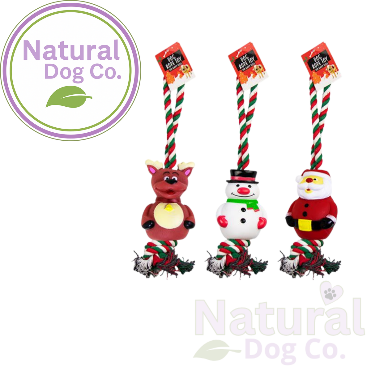 Three Christmas-themed dog toys by Natural Dog Co. shown on a white background: a reindeer, a snowman, and Santa Claus, each with a red-and-white striped rope handle and hanging tag.