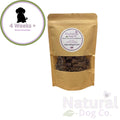 Kraft paper bag with dog treats from Natural Dog Co. on a white background