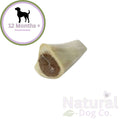 Dog bone treat with '12 Months+' recommendation and 'Natural Dog Co.' branding on a white background.